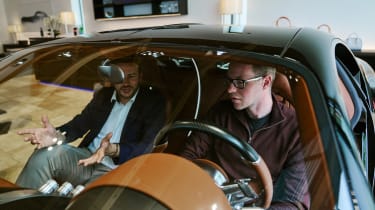 Bugatti representative and Sean Carson sitting in Chiron