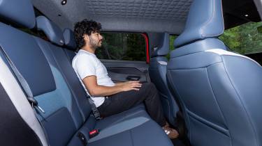 Auto Express senior staff writer Jordan Katsianis sitting in the Nissan Micra EV&#039;s rear seat