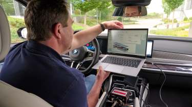 BMW i7 prototype with solid state battery - BMW technician testing inside the car 