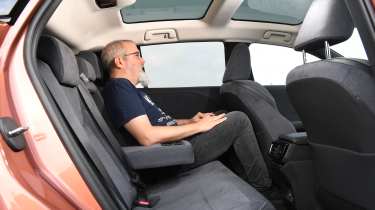 Lexus RZ 300e - rear seats with Auto Express senior test editor Dean Gibson