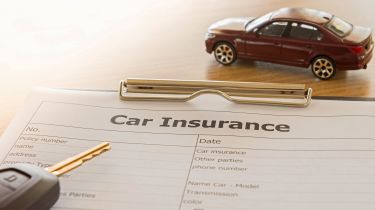 Car insurance form, car key and a model car