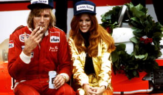 James Hunt celebrates winning the 1977 US Grand Prix win with a cigarette, a beer, and a Penthouse Pet