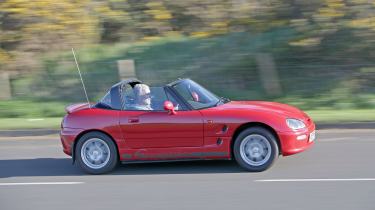 Used Suzuki Cappuccino - side action 