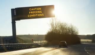 Motorway gantry sign displaying &#039;caution freezing conditions&#039; message