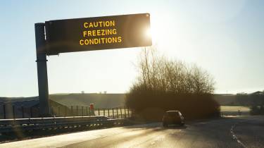 Motorway gantry sign displaying &#039;caution freezing conditions&#039; message