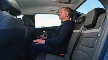 Citroen C4 X - rear seat room demonstrated by Executive editor, Paul Adam
