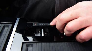 Auto Express products editor Kim Adams operating the Vauxhall Astra GSe&#039;s gear selector