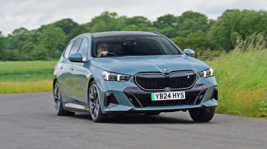 BMW i5 Touring - front cornering