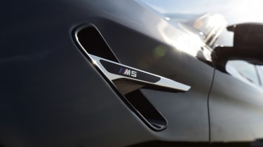 BMW M5 wing badge