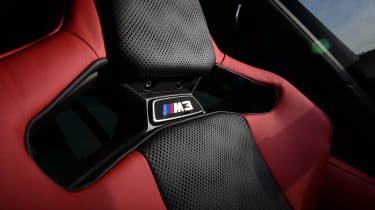 BMW M3 Touring Competition - front seat emblem