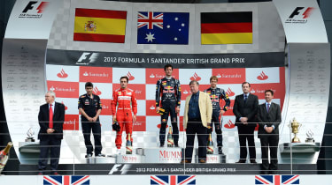 Fernando Alonso, Mark Webber and Sebastian Vettel on the new podium