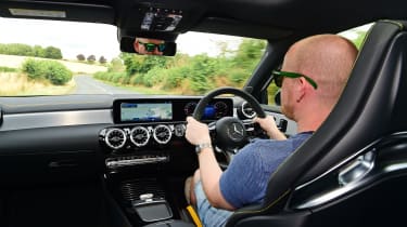 Auto Express chief reviewer Alex Ingram driving the Mercedes-AMG A45 S