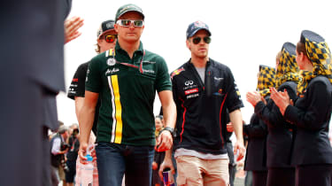 Kovalainen and Vettel after the driver parade
