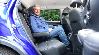 Auto Express current affairs and features editor Chris Rosamond sitting in the Honda ZR-V&#039;s back seat