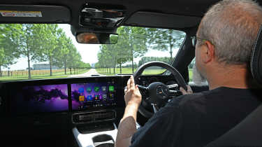 Auto Express senior road test editor Dean Gibson driving the Mercedes CLA Hybrid