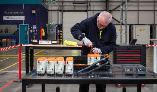 Technician working on EV batteries