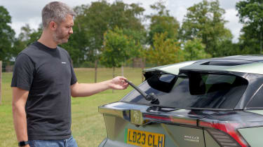 Carbuyer and DrivingElectric editor Richard Ingram inspecting the MG4 XPower&#039;s rear wiper