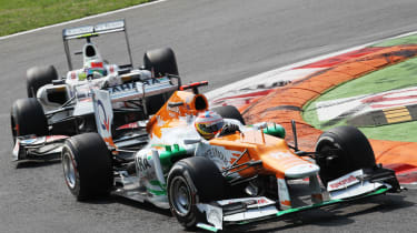 Paul di Resta and Sergio Perez battle