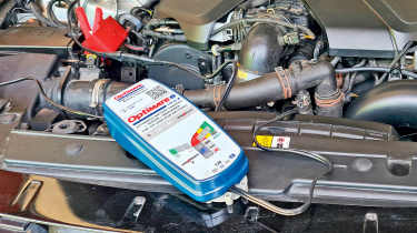 OptiMate 6-6A charger connected to a car