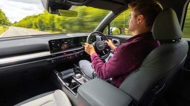 Alastair Crooks driving the Kia Sorento Hybrid