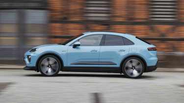 Porsche Macan Electric - side panning in town