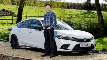 Tristan Shale-Hester standing next to the Honda Civic Sport