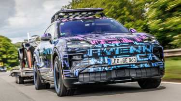 Porsche Cayenne Electric - front end towing a vintage car