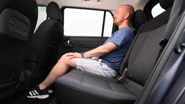Hyundai Inster - rear seat with former chief reviewer, Alex Ingram