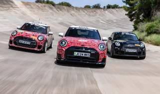 MINI Cooper JCW models on banked circuit - front action