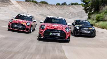 MINI Cooper JCW models on banked circuit - front action