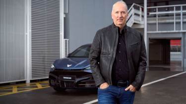 Cupra CEO Markus Haupt standing in front of a car