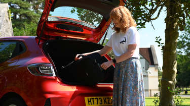 Auto Express pictures editor Dawn Grant loading the Renault Clio&#039;s boot