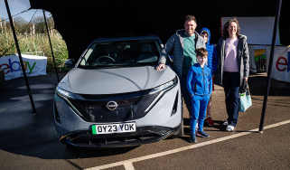 Auto Express head of digital content Steve Walker and family standing next to the Nissan Ariya