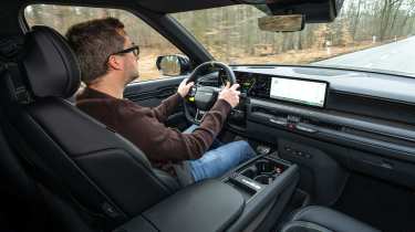 Anthony Ingram driving the Kia EV9 GT