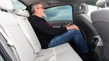 Auto Express senior test editor Dean Gibson sitting in back seat of Hyundai Ioniq 6