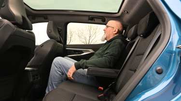 Renault Austral 2026 - rear seats being sat in by Auto Express senior test editor Dean Gibson