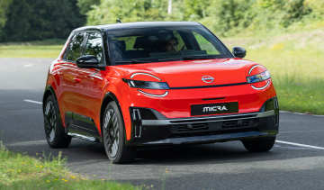 Auto Express senior staff writer Jordan Katsianis driving the Nissan Micra EV (exterior)