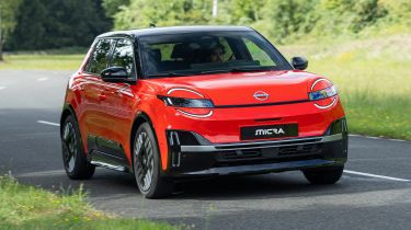 Auto Express senior staff writer Jordan Katsianis driving the Nissan Micra EV (exterior)