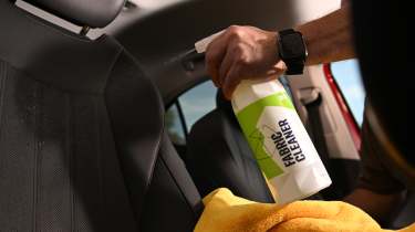 Auto Express products editor Tom Barnard cleaning a Skoda Superb&#039;s seat with Gyeon Q2M Fabric Cleaner