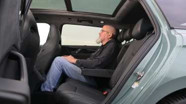 New Volkswagen Passat Estate - rear seats being sat in by Auto Express senior test editor Dean Gibson 