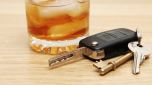 Car keys next to an alcoholic drink