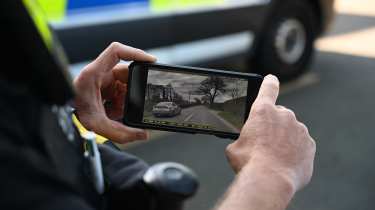 Dash cam footage on a phone screen