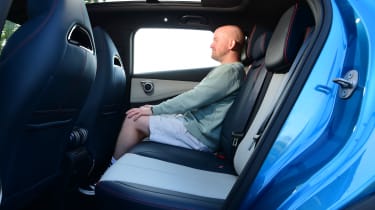 Auto Express chief reviewer Alex Ingram sitting in the BYD Atto 3&#039;s back seat