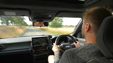 New Dacia Bigster 4x4 - interior, car being driven by Auto Express senior news reporter Alastair Crooks
