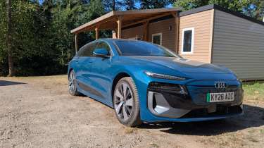 Audi A6 Avant e-tron parked outside a French holiday lodge
