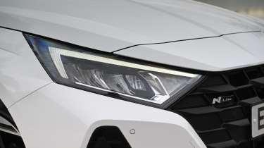 Hyundai i20 being driven in the UK - front headlight 