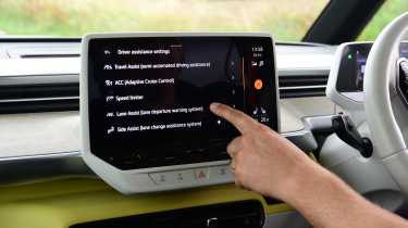 Auto Express editor Paul Barker operating the Volkswagen ID.Buzz&#039;s infotainment system