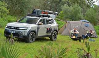 Auto Express deputy editor and vice president of Dacia Design David Durand camping next to the Dacia Duster