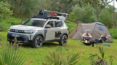 Auto Express deputy editor and vice president of Dacia Design David Durand camping next to the Dacia Duster