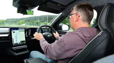 Auto Express editor Paul Barker driving the Renault Megane E-Tech